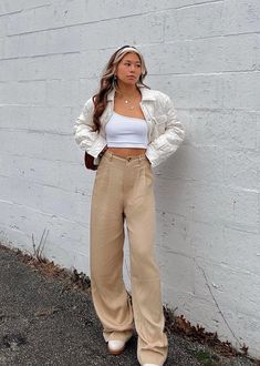 These tan wide leg trouser pants are the perfect closet essential! These pants are not only so trendy but they are also flattering. You guaranteed to be feeling your best self in these cute yet so comfortable pants. Dress these up with a blazer or wear them casually with a crop top! Model Info Meet Zoe! Here she is wearing a size Small. Hips: 35” | Waist: 25” | Bust: 32” | Height: 5’7” The Details Trouser Style Pant Wide Leg Fit High Waisted Dry Clean Only 100% Lyocell [#other] Dry clean only [/ Wide Leg Trousers Outfit Casual, Beige Cargo Pants Outfit, Tan Pants Outfit, Trousers Outfit Casual, Wide Leg Trousers Outfit, Beige Crop Top, Beige Crop Tops, Crop Top Jacket, Trouser Outfit