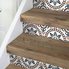 the stairs are decorated with colorful tiles and wood