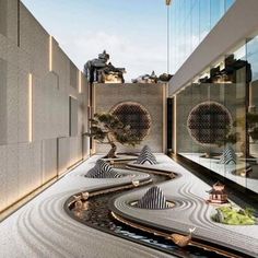 an indoor garden with trees and rocks on the ground