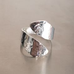 Instyleglamour brings you this lovely wide adjustable hammered lightweight thumb ring. Solid Sterling Silver 925 Hallmarked adjustable wraparound ring - perfect to wear everyday and would make a lovely gift! Comes in a gift box. You can find the matching earrings here:- https://www.etsy.com/uk/listing/1023741886/silver-hammered-earrings-hammered?click_key=8a4d9b4fe88efea08273d4b06d238b87d96884d0%3A1023741886&click_sum=7d860e15&ga_search_query=hammered&ref=shop_items_search_2&pro=1&frs=1 HERE IS Adjustable Sterling Silver Wide Band Open Ring, Adjustable Wide Band Open Ring In Sterling Silver, Adjustable Sterling Silver Wide Band Ring, Modern Hammered Adjustable Rings, Adjustable Wide Band Open Ring For Gift, Adjustable Open Band Wide Ring For Gift, Adjustable Wide Band Open Ring, Mothers Day Rings, Thumb Rings Silver