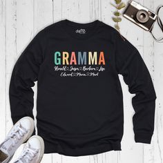 Grandma Sweatshirt With Names, Custom Grandma Sweatshirt, Personalized Grandma Sweater, Gramma Custom Sweatshirt, Custom Mothers Day Shirt. Our Grandma Sweatshirt With Names are Bella+Canvas branded. If Bella+Canvas is out of stock, I will send it from a trusted brand of the same size and quality. You can contact us in case of any problem or request. If you purchase a custom Grandma Sweatshirt With Names, I will send you a message to confirm the design, don't forget to check your message box. Your satisfaction is important to us :) Please check the size chart before purchase Grandma Sweatshirt With Names. We do not accept returns or exchanges on the Grandma Sweatshirt With Names unless there is a mistake or damage caused by us. Please make sure that you get the right size for yourself by l Long Sleeve Slogan T-shirt, Black Long Sleeve Sweatshirt With Name Print, Multicolor Cotton Sweater With Letter Print, Casual Long Sleeve Sweatshirt With Name Print, Fall Sweatshirt With Name Print And Long Sleeves, Winter Cotton Top With Name Print, Cotton Top With Name Print For Winter, Long Sleeve Name Print Tops For Fall, Long Sleeve Tops With Name Print For Fall