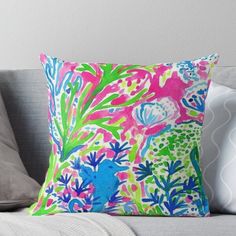 a colorful pillow sitting on top of a couch