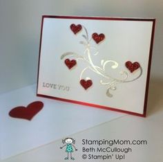 a white card with red hearts on it