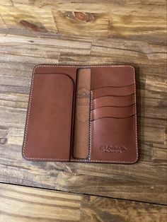 This is the LongHorn Long Wallet. It now has 4 pockets instead of 3. I now use Cream Thread for all of the long Wallets. The dimensions are 3-1/2 x 7 when closed. Leather. Being a natural material, the shade of leather will vary with every wallet made. Handmade Rectangular Wallets For Everyday Carry, Leather Long Wallet, Handmade Leather Wallet For Daily Use, Leather Long Wallet Men, Best Slim Wallet, Western Wallets, Long Wallet Men, High-end Rectangular Leather Wallet, Long Wallet Pattern