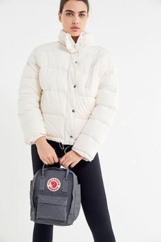 Fjällräven's classic Kånken backpack, now in a mini size perfect for festival days. Designed in 1978 and still just as relevant today with durable polyvinyl, a roomy main zip compartment and easily accessible front and side pockets. Complete with adjustable woven shoulder straps and dual top handles for easy carrying.Through their Arctic Fox Initiative, Fjallraven supports projects that help conserve nature including the threatened Arctic fox.Content + Care. 100% Polyvinyl Spot clean Imported Si Fjallraven Kanken Mini, Kanken Mini, Arctic Fox, Kanken Backpack, Fjallraven Kanken, Mini Backpack, Canada Goose Jackets, Women's Accessories, Urban Outfitters