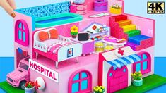 a doll house with pink furniture and accessories