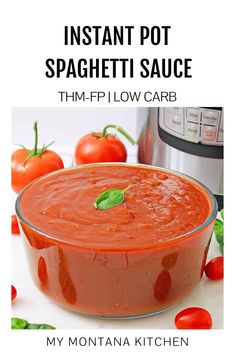 instant pot spaghetti sauce in a glass bowl with tomatoes around it and the title overlay reads instant pot spaghetti sauce tim - fi low carb