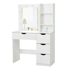 a white dressing table with drawers and a mirror on the top shelf, next to a lamp