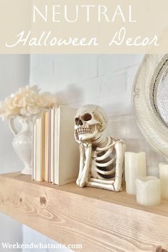 a skeleton sitting on top of a shelf next to candles