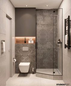 a bathroom with a toilet, shower and stand up shower stall in it's corner