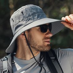 Stay Protected and Stylish with Our Wide Brim Sun Hat Introducing the ultimate headgear for your outdoor adventures - the Wide Brim Waterproof UV Protection Sun Hat for Men. This versatile hat is designed to keep you comfortable and protected from the sun's harsh rays, no matter where your adventures take you. Whether you're hiking through rugged trails, casting a line on a sunny day, or climbing to new heights, this hat is your perfect companion. Crafted from high-quality cotton, this hat is bo Outdoor Wide Brim Hat, Durable Short Brim Hat For Outdoor, Casual Adjustable Windproof Bucket Hat, Casual Waterproof Sun Hat For Travel, Lightweight Wide Brim Hat For Outdoor Activities, Waterproof Outdoor Bucket Hat, Casual Bucket Hat For Hiking, Waterproof Short Brim Hat For Outdoor, Waterproof Brimmed Hat For Outdoor