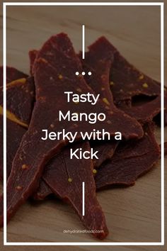 Tasty mango jerky with a kick on a wooden surface.