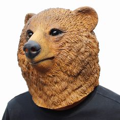 a man wearing a bear mask on his face