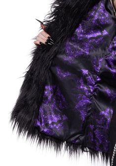 cuz be bad but with style. This oversized coat has a long faux fur construction, a collar, side pockets, hook and eye closures, and a satin lining. Winter Feather Trim Outerwear For Night Out, Winter Outerwear With Feather Trim For Night Out, Faux Fur Coat For Night Out, Feather Trim Outerwear For Night Out In Winter, Winter Night Out Outerwear With Feather Trim, Black Halloween Outerwear, Long Coat For Halloween, Black Party Outerwear With Feather Trim, Black Fur Coat With Faux Fur Trim For Party