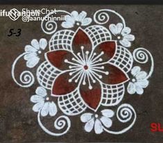 a white and red flower design on the ground with words below it that read,