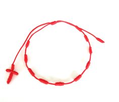 "Cross rosary red string bracelet for a chic divine protection from negative energies and bad vibes. The rosary arrives in a beautiful package ready for gift giving or keeping with a sweet, meaningful blessing for you and loved ones that reads, \"𝙈𝙖𝙮 𝙮𝙤𝙪 𝙗𝙚 𝙋𝙧𝙤𝙩𝙚𝙘𝙩𝙚𝙙, 𝙃𝙖𝙥𝙥𝙮, 𝙃𝙚𝙖𝙡𝙩𝙝𝙮 𝙖𝙣𝙙 𝙒𝙚𝙖𝙡𝙩𝙝𝙮\". 𝗖𝗵𝗲𝗰𝗸 𝗵𝗲𝗿𝗲 𝗮𝗹𝗹 𝗼𝘂𝗿 𝗼𝘁𝗵𝗲𝗿 𝗗𝗲𝗰𝗲𝗻𝗮𝗿𝗶𝗼𝘀 𝗱𝗲𝘀𝗶𝗴𝗻𝘀 https://etsy.me/32xSkiL 𝗖𝗿𝗼𝘀𝘀 + 𝗿𝗼𝘀𝗮𝗿𝘆 𝗴𝗶𝗳𝘁𝘀 https://etsy.me/3GYX Red Adjustable Rosary Bracelet With Round Beads, Adjustable Red Rosary, Red Handmade Adjustable Rosary Bracelet, Red Adjustable Rosary With Round Beads, Adjustable Red Rosary With Round Beads, Adjustable Red Rosary Bracelet, Celebrity Bracelets, Knots Bracelet, Bracelet Knot