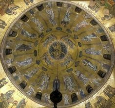 the inside of a dome with paintings on it