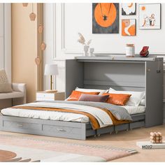 a bed sitting in a bedroom next to a white chair and table with an orange pillow on it