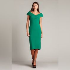 This Textured Crepe Gown Pairs Graphic Appeal With Elegant Ease. It Has A Draped V-Neckline And Cap Sleeves Accentuated By Contrast Blocking. Color: Bamboo Elegant Green V-neck Mini Dress, Formal Green Fitted V-neck Dress, Green V-neck Midi Dress For Gala, Fitted Green V-neck Dress For Evening, Green V-neck Midi Dress For Cocktail, Green Midi-length V-neck Dress For Formal Occasions, Fitted Dress With Open Neckline For Cocktails, Green V-neck Midi Dress For Formal Occasions, Fitted V-neck Green Dress