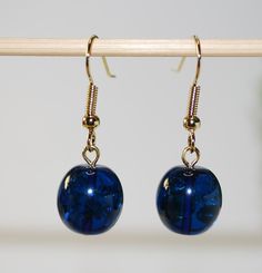 Dangle earrings made of blue Caribbean amber Elegant items heart cut gold plated silve hooks. Weight 3 g.  Deep blue and dark red color Amber received by the natural method of heating. The original Caribbean amber is heated in special autoclaves to become an intense color. 1699 ------------------------------------------------------------------------- DELIVERY We ship all of our items within 1-2 business days after receiving payment. We use Regular Registered Post to send our items, which ensures reliable delivery.  The Average Delivery time: EU Countries - 5-8 business days; USA, Canada, Australia, Asia - 10-15 days. ------------------------------------------------------------------------ Thanks for your feedback in advance! It is always great to hear from you! ABOUT AMBER  Amber is a foss Blue Amber, Amber Earrings, Oval Beads, Beads Earrings, Natural Amber, Amber Jewelry, Evil Spirits, Earrings Blue, Healing Powers