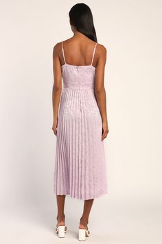 The Lulus Regal Romance Lavender Floral Jacquard Pleated Satin Midi Dress is bursting with sweet and romantic vibes! Sleek woven satin jacquard, with a floral pattern throughout, shapes this dreamy dress that has adjustable spaghetti straps and a sweetheart neckline. A seamed bodice tops a banded waist and a pleated midi skirt. Hidden back zipper/clasp. Fit: This garment fits true to size. Length: Mid-calf length. Size medium measures 48.5" from shoulder to hem. Bust: Works best for A to C cup s Lavender Midi Dress For Wedding, Feminine Purple Midi Dress For Wedding, Feminine Lavender Midi Dress For Garden Party, Feminine Mauve Midi Dress, Lavender Midi Dress For Party, Spring Party Midi Dress In Mauve, Lavender Bridesmaid Dress For Spring, Spring Lavender Bridesmaid Dress, Spring Party Midi Dress In Lavender