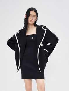 MO&Co. Women's Wool Blend Contrast Pocketed Coat Features : - Wide lapel collar- Relaxed fit- Button closure Code: MBC3OVCT02The back length of size S is 72cmMATERIALS & CARE Material: 81.4% Wool 18.6% PolyamideDo not wash, do not bleachHang to dry, do not tumble dryLow-temperature ironing, professional dry cleaningDo not put the sun under long exposureREMINDER: All items are measured manually. Please note that it's reasonable that there might be minor measurement differences (1-2cm) on some ite Fitted Outerwear With Contrast Collar And Long Sleeves, Designer Black Outerwear With Suit Collar, Black Outerwear With Button Cuffs And Suit Collar, Black Outerwear With Suit Collar And Button Cuffs, Spring Black Blazer With Concealed Placket, Black Blazer With Concealed Placket For Spring, Designer Black Structured Blazer, Structured Black Blazer With Buttons, Black Structured Blazer With Buttons