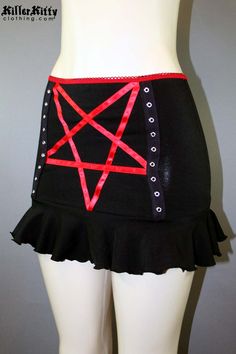 DETAILS Custom-made pentagram mini skirt created using red satin ribbon with black grommet tape on the front and a red elastic waist band. LENGTH: 13" (fits at hip) MODEL: Mannequin has 37" hip VIEW SIZE GUIDE CARE: Hand wash cold, hang dry. SHIPPING: Made When Ordered Please allow 1-2 WEEKS to ship. Model Mannequin, Red Satin, Waist Band, Satin Ribbon, Size Guide, Mini Skirt, Elastic Waist, Custom Made, Mini Skirts