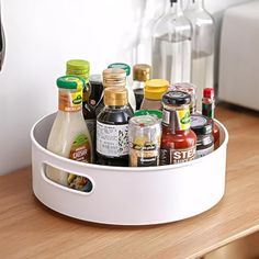 a white container filled with condiments on top of a wooden table