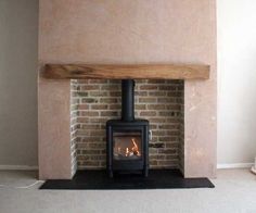 a wood burning stove sitting inside of a living room