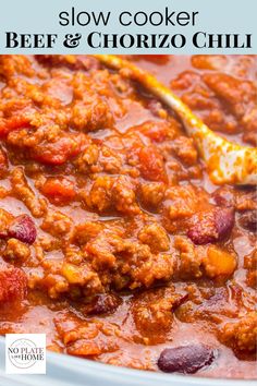 slow cooker beef and chorizo chili in a white bowl with a spoon