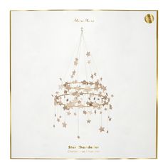 This gorgeous chandelier is a stunning way to add a touch of style to any room. It's beautifully crafted with lots of glittering gold stars with gold wire and thread. Perfect for the holidays, or any time of the year where you want a decoration that is the star attraction! Polish Pajaki, Chandelier Christmas Decorations, Glitter Product, Chandelier Decorations, Eco Glitter, Star Chandelier, Gold Glitter Stars, Meri Meri, Star Party