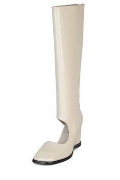 Cut-out knee-high wedged boot Fits true to size Measurements taken from a size 7 3" Heel, 0.25" Platform 15.5" Shaft, 13" Leg Opening Leather Upper, Leather / Fabric Lining, Synthetic Sole Zipper closure