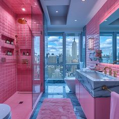 a bathroom with pink walls and marble counter tops, along with a walk in shower