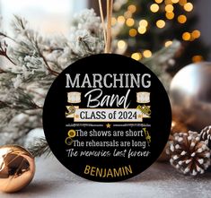 a christmas ornament that reads marching band class of 2014 the shows are short