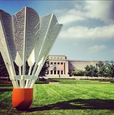 a large sculpture in the middle of a grassy field