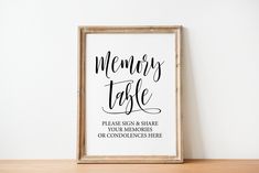 there is a framed sign that says memory table