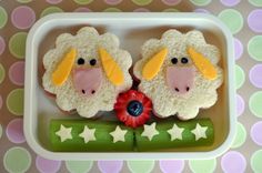 two cupcakes in the shape of sheep with stars on them