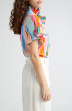 A crisp cotton blouse goes in for the charm with ripples of ruffles embellishing the placket and sleeves. 26" length (size Medium) 100% cotton Dry clean Imported Multicolor Ruffled Tops For Daywear, Multicolor Flutter Sleeve Blouse With Ruffles, Multicolor Tops With Ruffled Collar For Summer, Cotton Ruffle Puff Sleeve Blouse, Feminine Multicolor Cotton Tops, Multicolor Cotton Ruffle Tops, Cotton Puff Sleeve Blouse With Ruffles, Cotton Ruffle Blouse For Daywear, Cotton Blouse With Ruffled Collar