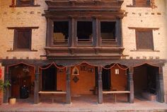 an old building with wooden balconies and windows