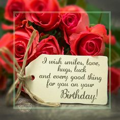 a bouquet of red roses with a card saying i wish smiles, love hugs luck and every good thing for you on your birthday