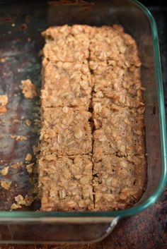 some food is in a glass dish on a table and it looks like granola bars