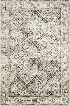 an area rug with black and white designs