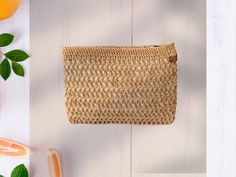 This exquisite crochet raffia bag combines style with functionality, perfect for the summer season. Handcrafted from high-quality natural raffia fiber, it offers a lightweight and durable solution for carrying all your essentials. With its spacious interior and comfortable handles, this bag is ideal for beach trips, farmers market shopping, or everyday use. The gorgeous crochet pattern adds a touch of elegance to this bohemian-inspired design, making it a must-have accessory for any fashionista. Don't miss out on this unique and eco-friendly addition to your wardrobe. Order your very own crochet raffia bag today and be the envy of all your friends! Measurements; 29x20x3cm Color :camel Lining :yes If you want different color please convo me. Beige Woven Crochet Clutch Bag, Crochet Pouch Clutch For Beach, Beige Handwoven Crochet Clutch Bag, Handwoven Beige Crochet Clutch Bag, Beige Crochet Rectangular Clutch, Handmade Casual Beige Clutch, Casual Handmade Beige Clutch, Natural Woven Crochet Clutch Bag, Beige Handwoven Clutch For Daily Use