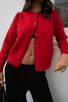 Introducing the Nikova Cardigan in Red with pearlescent buttons. The full length and ribbed hem, neckline, and cuffs provide a regular fit that keeps you cozy. Upgrade your wardrobe with this versatile and timeless piece. Red Winter Sweater With Ribbed Cuffs, Cozy Outerwear With Button Cuffs, Winter Sweater With Button Cuffs, Solid Outerwear With Button Cuffs For Layering, Winter Long Sleeve Cardigan With Button Cuffs, Winter Cardigan With Ribbed Cuffs, Winter Layering Tops With Button Cuffs, Red Button-up Cardigan For Fall, Solid Cardigan With Button Closure For Winter