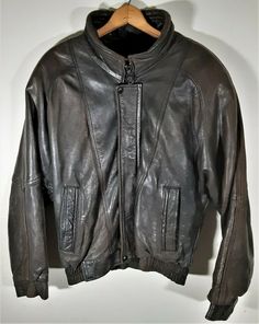 RARE Vintage Bremans Leather Fur Lined Bomber Jacket Jacket is in very good vintage condition.  Leather is soft with perfect wear.  One small hole on the sleeve and a bit of stitching missing around one pocket.  Please see pictures for details.  Sherpa  fur zip out lining.  100% Genuine Leather.  Made in U.S.A. Size Medium. Pit to pit:  25"   Length (with collar):  31  without collar: 27.5"   Collar seam to end of wrist:  35" Coloured Leather Jacket, Cafe Racer Jacket, Racer Jacket, Colored Leather, Sherpa Lined, Leather Jackets, Cafe Racer, Brown Leather, Bomber Jacket