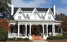 a large white house with porches and columns