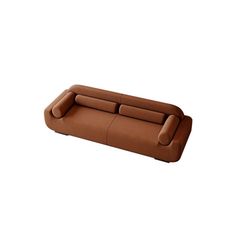 a brown leather couch sitting on top of a white floor