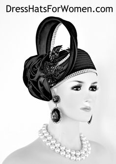 Women’s Black Shaped Satin Custom Made Pillbox Designer Fashion Cocktail Hat With Ornate Black Rosette Bowing. This Haute Clouture Headpiece Is Inspired By The 1920s Flapper Art Deco Era. This Dress Hat Is Trimmed With Exotic Bowing Containing A Hoop Type Of Satin Bow Enhanced With Handmade Satin Rosettes. Also Adorned On The Stylish Contemporary Headpiece Are Black Silk Flowers Mixed With Sequin And Glass Beads. Acrylic Rhinestones Encircle The Hoop Part Of The Bow As Well As Around The Crown Of This Formal Holiday Hat. This Women’s Hat Is Suited For Cocktail Parties, Weddings, Holidays, Formals, The Kentucky Derby, Royal Ascot, Melbourne Cup, Dubai World Cup And Special Occasions. This Church Hat Is Custom Made And Designed By nyfashionhats.com

Hats Women’s A Division Of NY Fashion Hats Special Occasion Hats, Classy Hats, Bespoke Hats, Flapper Art, Horse Races, Royal Ascot Hats, Occasion Hats, Couture Hats, Bridal Hat