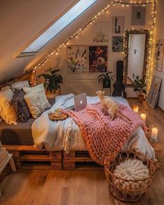 a cat is laying on top of a bed in a room with lots of lights