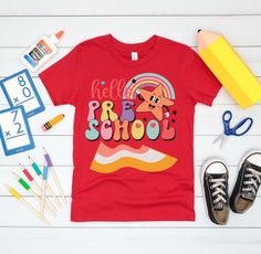 "hello pre school Youth Short Sleeve T-Shirt 1st day of pre school t shirt, back to school tee shirt, cute Graphic colorful T shirt, cute unisex pre school T shirt, first day of school shirt Introducing the Bella+Canvas 3001Y Tee Shirt - a vibrant and joyful addition to your little one's wardrobe! Our Hello Pre School tee features a delightful and colorful design that perfectly captures the essence of the exciting pre-school days. Crafted with the utmost care and using premium materials, this te Playful Funny Print T-shirt For School, Cute Multicolor T-shirt For Back To School, Playful T-shirt For Back To School, Multicolor Funny Print T-shirt For School, Playful Graphic Print T-shirt For School Events, Playful Red Tops For School, Back To School Multicolor Fun T-shirt, Multicolor Fun T-shirt For Back To School, Fun Multicolor T-shirt For Back To School